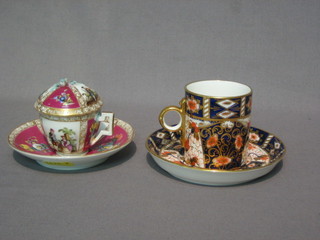 A Derby style coffee can and saucer by Sandbach & Co together with a German style cabinet cup and saucer (chip to base)