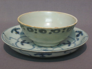A Tek Sing porcelain bowl with matching saucer, recovered from the ship wreck
