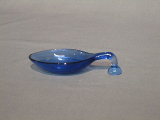 A blue glass measuring spoon 4"