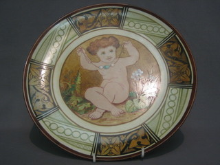 A   Victorian  Royal  Worcester  Porcelain  Factory  Works   test  sample    plate,    decorated   a   seated   cherub    by    Elizabeth Granville-Uttermann dated 1880 12"