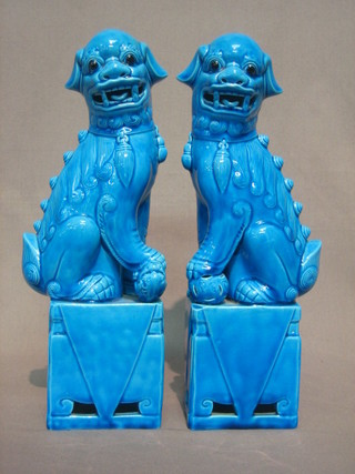 A  pair  of 20th Century blue glazed porcelain  figures  of  seated Dogs of Fo 11"