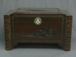 A  20th  Century  carved  camphor  coffer  with  hinged  lid  40"