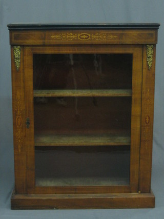 A   Victorian   inlaid  walnut  Pier  cabinet,   the   interior   fitted adjustable  shelves  enclosed  by  a  panelled  door,  raised  on   a platform base 29"