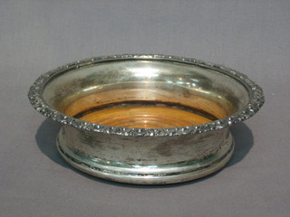 A  19th  Century silver plated wine coaster with cast rim  6  1/2"