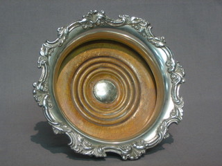 A silver plated wine coaster with cast border 7"