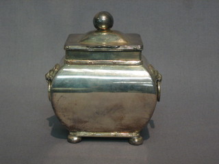 A  Georgian  style  square silver plated  caddy  with  hinged  lid, raised on bun feet