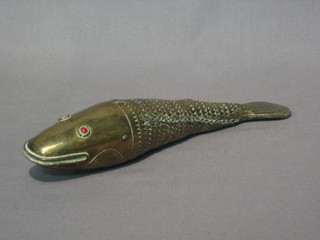 An  18th/19th  Century gilt metal articulated fish  with  hardstone set eyes (1 missing and tail loose) 9"