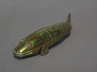 A  19th Century brass articulated fish with hardstone set  eyes  (1 eye missing, 1 fin missing)