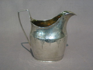 A  Georgian  silver  cream  jug with  parcel  gilt  interior  (marks rubbed) 4 ozs