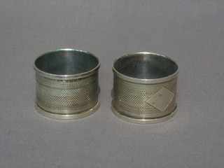 A  pair  of  silver  napkin  rings  with  engine  turned  decoration Birmingham 1931