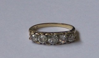 A lady's gold dress ring set 5 old cut diamonds
