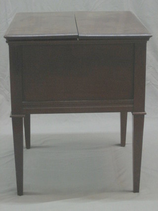 A 1920's mahogany framed square surprise table with hinged lid, raised on square tapering supports 23"