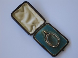 A crystal locket with gilt metal mounts decorated demi-pearls