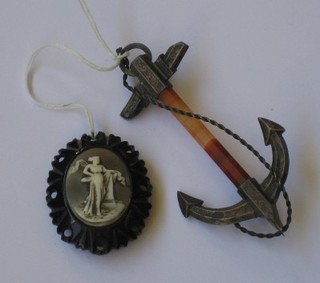 A "jet" brooch and  hardstone and silver brooch in the form of an anchor