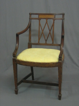 An Edwardian Georgian style mahogany bar back desk chair with tracery back and upholstered yellow seat, raised on square tapering supports ending in spade feet with H framed stretcher