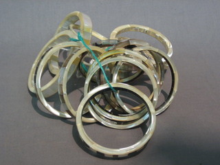 A quantity of mother of pearl bangles