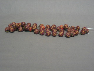 A string of carved ivory beads