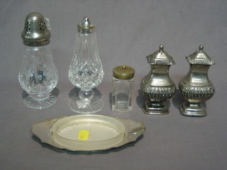 A cut glass salt and pepper with silver mounts 6", a silver plated salt and pepper, a butter dish and 1 other pepper