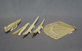 3 carved ivory figures of crocodiles, a pair of glove stretchers and a fan