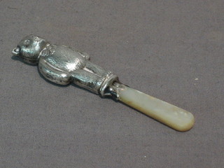 A child's silver rattle in the form of a teddybear with mother of pearl teething bar, Birmingham 1947