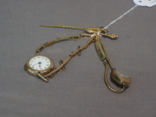 2 lady's gold cased wristwatches and a gold stick pin