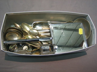 A collection of silver plated flatware