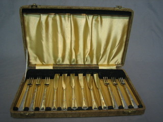 A set of 6 silver plated fish knives and forks