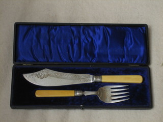 A pair of silver plated fish servers, cased