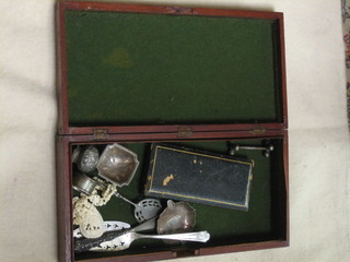 A silver handled shoe horn and matching button hook, other curios contained in a rectangular mahogany box