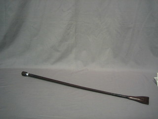 A leather riding whip by Swayne, Eardley & Biggs with silver band