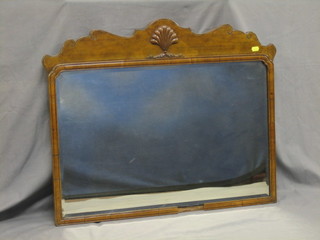 A Queen Anne style arch shaped plate wall mirror contained in a walnut frame 30"    