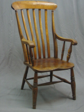 A 19th Century elm stick and rail back kitchen carver chair (reduced in height)