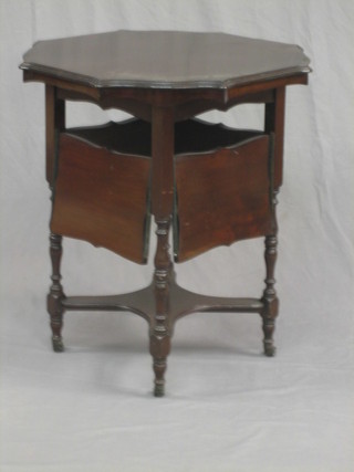 An Edwardian circular mahogany occasional table with 4 drop down flaps to the sides 24"
