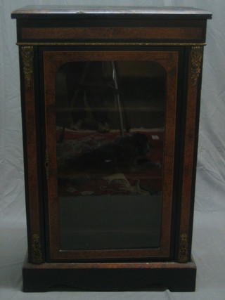 A Victorian ebonised and figured walnut Pier cabinet enclosed by an arch panelled door with gilt metal mounts throughout 26"