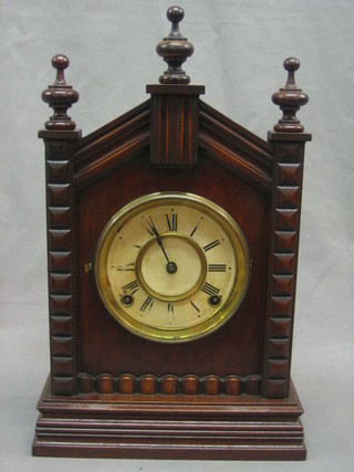 An American Ansonia 8 day striking shelf clock contained in a walnut case