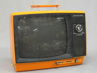 A 1960's/70's British Standard Teleton 11" portable black and white television, the reverse of the case marked Model TW-12 BS (for decorative purposes only)