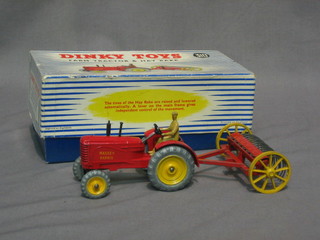A Dinky 310 farm tractor and hay rake, boxed