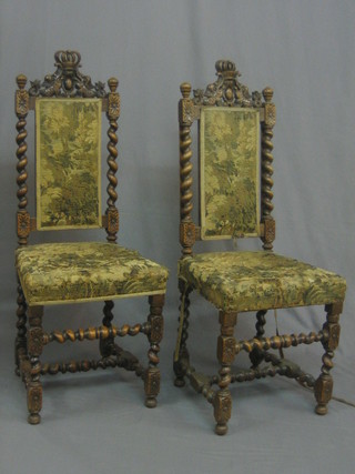 A pair of 19th Century walnut Carolean style high back dining chairs with upholstered seats, raised on spiral turned supports