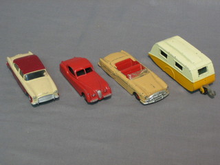A Dinky Humber Hawk no. 165, a Dinky Jaguar no. 157, a Dinky Packard no. 132 and a Dinky Caravan no. 190