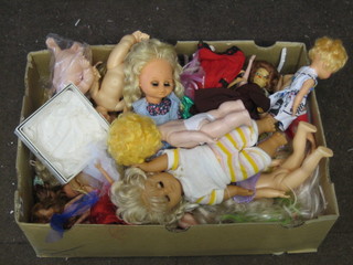 A collection of various Barbie and other dolls
