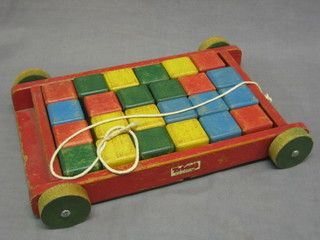 24 Triang wooden blocks contained in a pull-along trailer