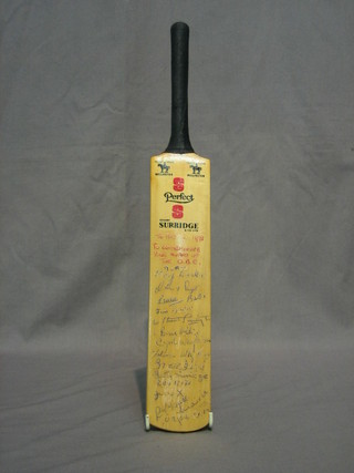 A Stuart Surridge miniature 1978 cricket bat with the signatures of various England and Surrey players