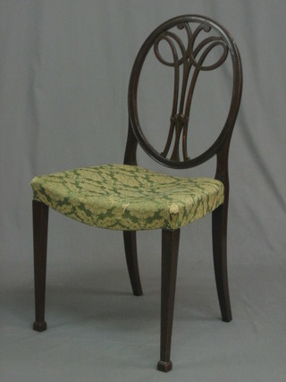 An Edwardian Hepplewhite style bedroom chair with vase shaped slat back and upholstered seat, raised on square supports