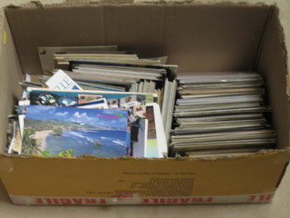 A large collection of coloured postcards