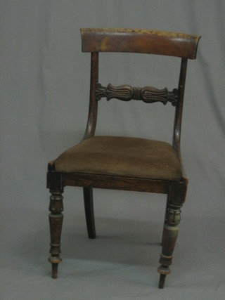 A 19th Century rosewood bar back dining chair with carved mid rail and upholstered drop in seat, raised on turned and reeded supports