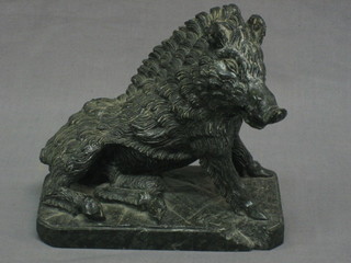 A carved stone figure of a seated wild boar 6"