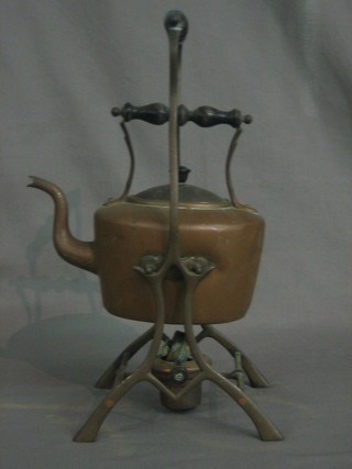 A 19th Century copper tea kettle on stand complete with burner