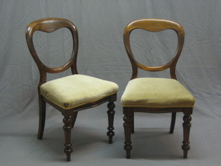A pair of Victorian mahogany spoon back dining chairs with shaped mid rails