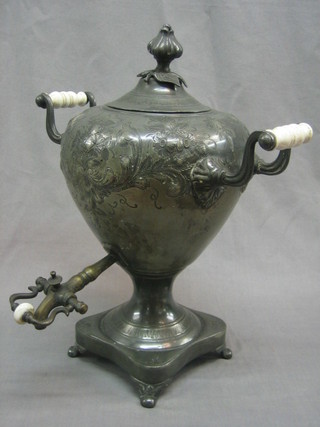 A Britannia metal twin handled tea urn