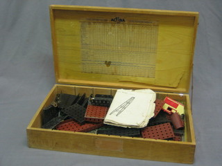 A Meccano set, black and red contained in a wooden box 18"